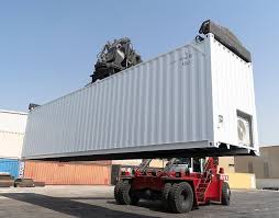 a container being lifted by a forklift