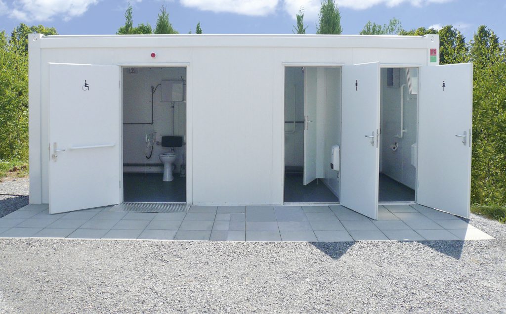 a white building with doors open